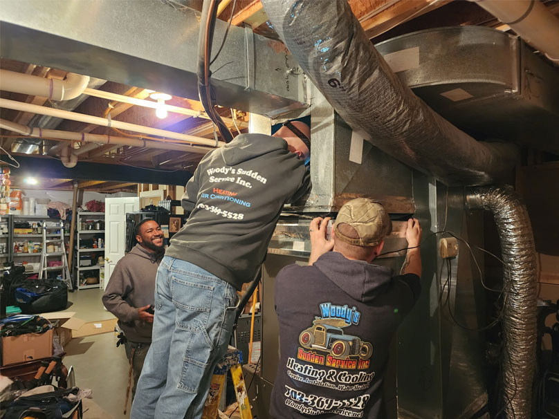 Men looking at a new furnace installation